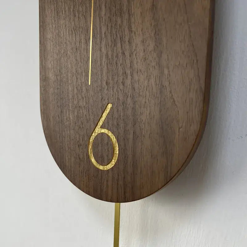 Orologio a pendolo Linea in noce e oro